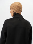 Unisex Cashmere Basic Beanie Almond worn by model, back view on white background #color_golden-brown