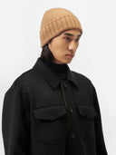 Unisex Cashmere Basic Beanie Almond worn by model, side view on white background #color_golden-brown