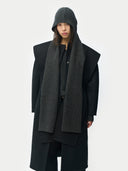 Cashmere Hooded Wrap Black worn by model, detail view, on white background