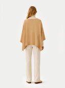 Women's Boat-Neck Cashmere Poncho Beige  worn by model, back view on white background
