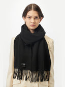 Cashmere Fringed Scarf Black worn by model, detail view on white background