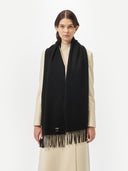 Cashmere Fringed Scarf Black worn by model, detail view on white background