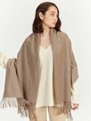 Taupe Cashmere Wide Fringe Scarf worn by model, detail view on white background