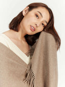 Taupe Cashmere Wide Fringe Scarf worn by model, detail view on white background