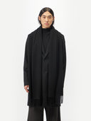 Unisex Cashmere Oversized Woven Scarf Black worn by model, detail view on white background