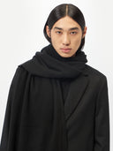 Unisex Cashmere Oversized Woven Scarf Black worn by model, detail view on white background