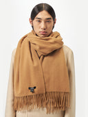 Unisex Cashmere Oversized Woven Scarf Almond worn by model, detail view on white background