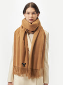 Unisex Cashmere Oversized Woven Scarf Almond worn by model, detail view on white background