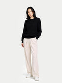 Women's Black Cashmere Crewneck Sweater worn by model, front view on white background