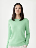 Women's Green Ash Cashmere Crewneck Sweater worn by model, detail view on white background