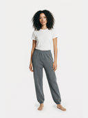 Women's Cashmere Sweatpants Plum Kitten worn by model, front view on white background