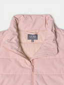 Pink jacket with 'Gobi' brand label on a light gray background