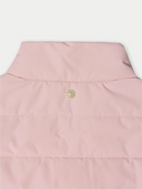 Close-up of a pink jacket with a green logo on a white background