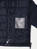 Navy puffer jacket with a brand label on a white background #color_navy