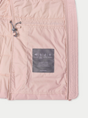 Close-up of a pink jacket with a label on a white background