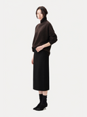 Women's Black Cashmere Cashmere Tailored Skirt worn by model, side view on white background