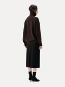 Women's Black Cashmere Cashmere Tailored Skirt worn by model, back view on white background
