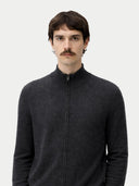 Man wearing a dark gray zip-up cashmere sweater against a white background. #color_charcoal 