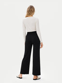 Women's Cashmere Pants Black worn by model, back view on white background