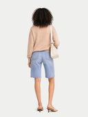 Women's T-Neck Organic Colour Cashmere Sweater Beige worn by model, back view on white background