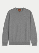 A heather gray crewneck sweater with long sleeves, laid flat against a light gray background. A small brown brand label reading 'GOBI' is visible inside the collar.