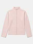 A light pink knit mock-neck sweater with a central braided cord detail running down the front, displayed on a clean, light gray background.