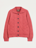 A coral pink cable-knit cardigan sweater with a collar, front buttons, and front pockets, shown flat on a light gray background. The brand label 'GOBI' is visible inside the collar.