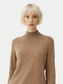 Women's Taupe Cashmere Mock Neck Sweater worn by model, detail view on white background