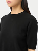 Women's Cashmere Elbow-Length Sleeve Cashmere Sweater Black worn by model, detail view on white background