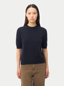 Women's Short-Sleeve Cashmere Sweater Navy worn by model, detail view on white background