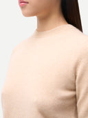 Women's Cashmere Elbow-Length Sleeve Cashmere Sweater Beige worn by model, detail view on white background