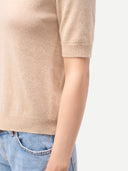 Women's Cashmere Elbow-Length Sleeve Cashmere Sweater Beige worn by model, detail view on white background