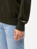 Women's T-Neck Organic Colour Cashmere Sweater Avocado worn by model, detail view on white background