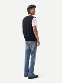 Timeless V-Neck Cashmere Vest Black worn by model, back view, on white background
