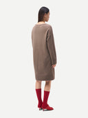 Women's Seamless Crewneck Cashmere Dress Taupe worn by model back view on white background