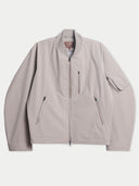 Flat lay of the CashmereTech bomber jacket in smoke gray with a ribbed stand collar, full-length zip and zip pockets.