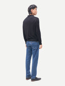 Men Classic Polo Shirt with Long Sleeve Black worn by model, back view on white background
