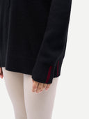 Women's Cashmere Pullover Hoodie Black worn by model, detail view on white background