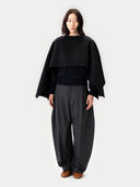 Versatile Cashmere Poncho Black worn by model, front view, on white background