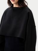 Versatile Cashmere Poncho Black worn by model, detail view, on white background