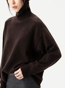 Unisex High-Neck Cashmere Sweater Mole worn by model, detail view, on white background