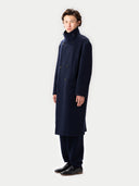 Unisex Cashmere Trench Coat Navy Blazer worn by model side view on white background