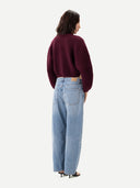 Women's Burgundy Cashmere Oval-Sleeve Cropped Sweater worn by model, back view on white background