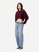 Women's Burgundy Cashmere Oval-Sleeve Cropped Sweater worn by model, side view on white background