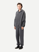 Men wearing a gray hoodie on a white background