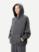 Men wearing a gray hoodie on a white background
