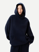 Unisex Inida Ink Cashmere Sweatshirt worn by model, detail view on white background
