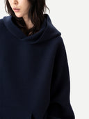 Unisex Inida Ink Cashmere Sweatshirt worn by model, detail view on white background