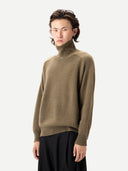 Unisex High-Neck Cashmere Sweater Aloe worn by model, detail view, on white background