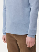 Men's Cashmere Silk Lightweight Sweater Celestial Blue worn by model, detail view on white background